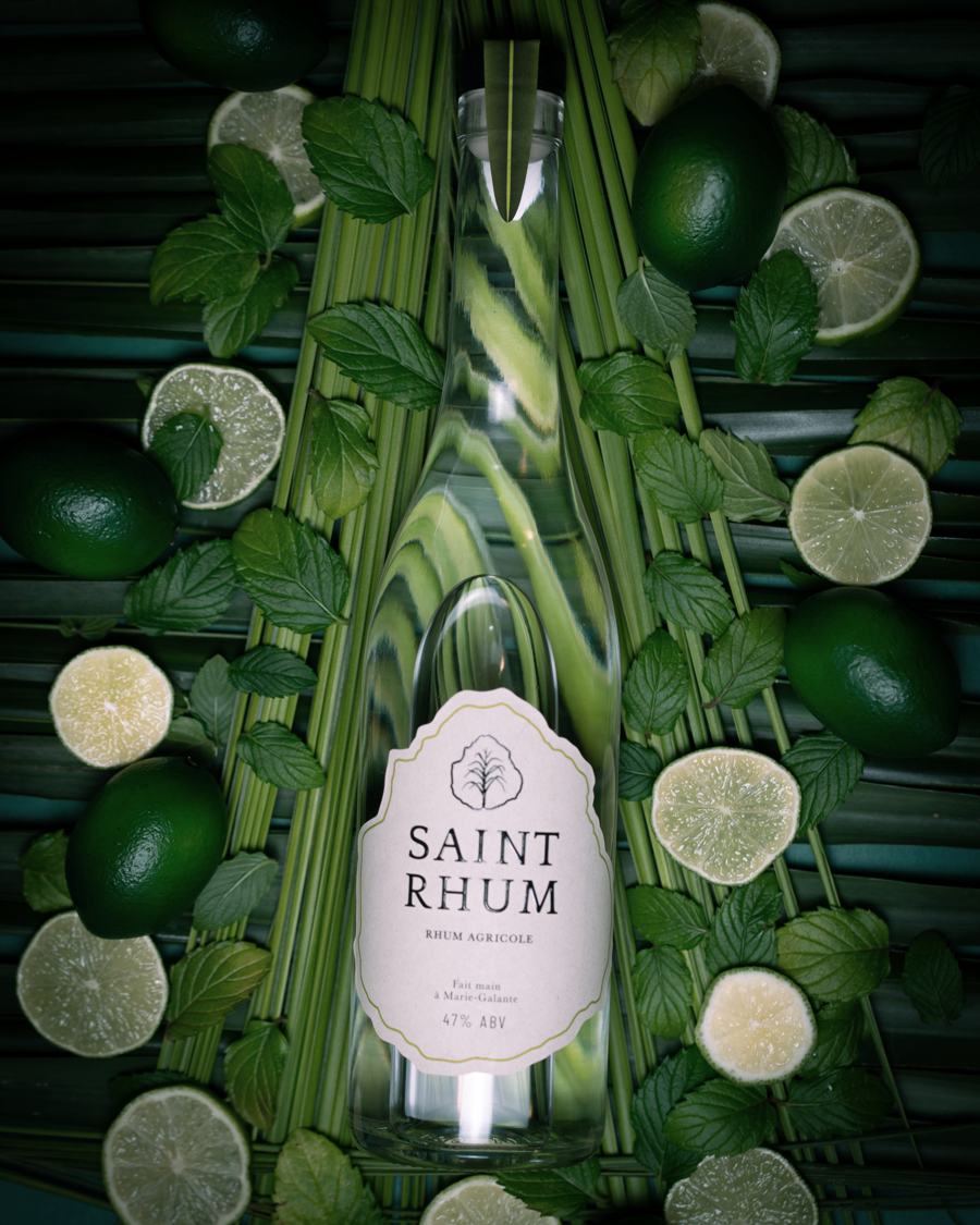 Saint Rhum among sugarcane stalks and limes